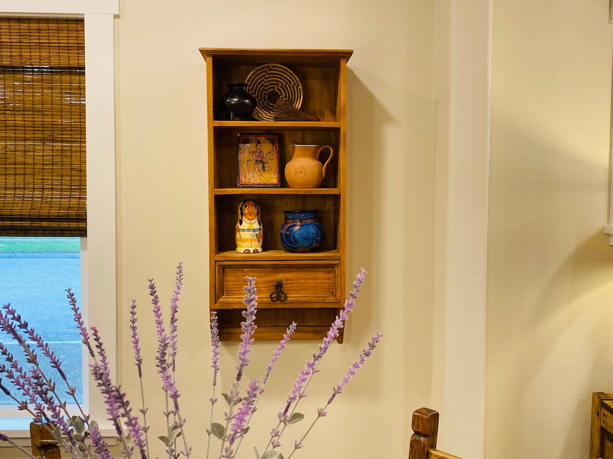 Wall shelf with pottery and a lavender plant