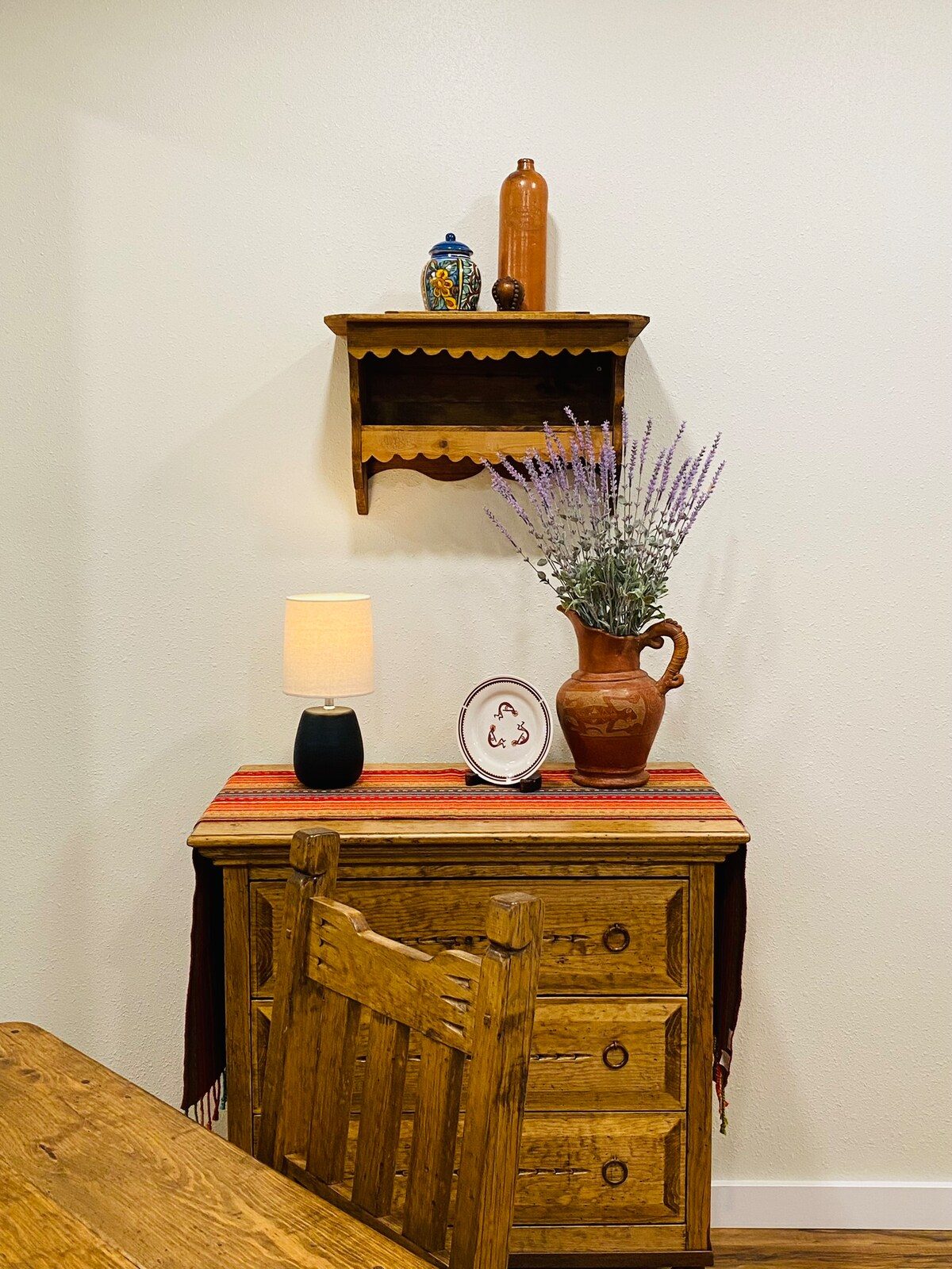 Wooden cabinet with shelf, pottery and lavender